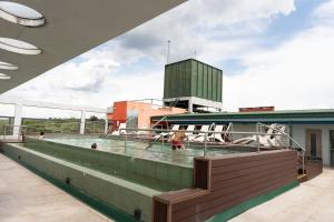 a swimming pool on the roof of a building at City Falls Iguazú in Puerto Iguazú
