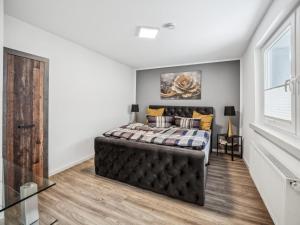 a bedroom with a bed and a window at Mompels in Rübeland +21 photos