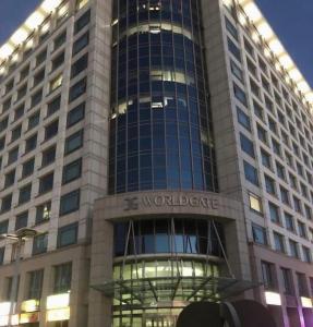 a tall building with a sign on the front of it at Incheon Airport Yeongjong Guesthouse in Incheon