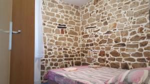 Postel nebo postele na pokoji v ubytování Holiday House Popovic