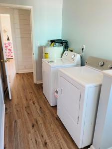 a laundry room with a washer and dryer at 3 4 Time in Holden Beach