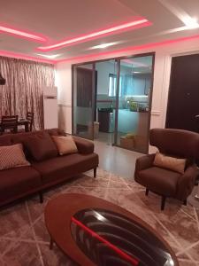 a living room with a couch and a table at Woodloft in Lagos