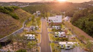 an aerial view of an rv park with a street at Sokcho Supuro Caravan in Sokcho