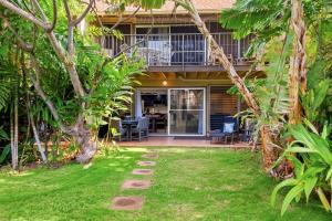 a house with a garden and a patio at Maui Sands 3C in Honokowai +38 photos