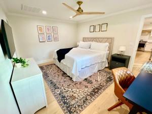 a bedroom with a bed and a living room at Casa Gia- Quiet Luxury Biltmore Area - Heated Pool in Phoenix