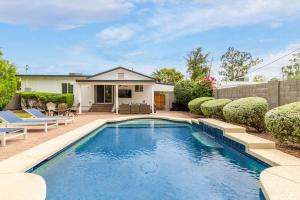 a swimming pool in the backyard of a house at Casa Gia- Quiet Luxury Biltmore Area - Heated Pool in Phoenix