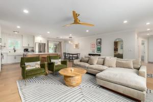 a living room with a couch and a table at Casa Gia- Quiet Luxury Biltmore Area - Heated Pool in Phoenix +30 photos
