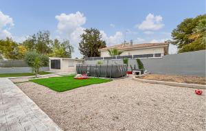 a backyard with a lawn and a house at Villa Villaplana in Fortuna +29 photos
