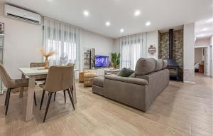 a living room with a couch and a table at Villa Villaplana in Fortuna