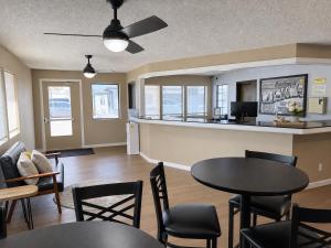 a living room with a table and chairs at Super 8 by Wyndham Blackwell in Blackwell