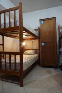 Una cama o camas en una habitación de Hostelito Hotel