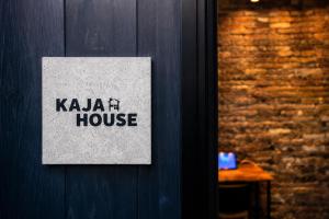 a sign on the door of a kawi house at KAJAhause in Osaka