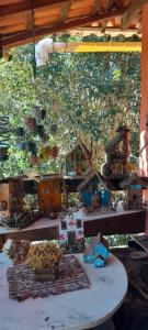 a table with a toy train set on it at Recanto da Serra e camping in Itamonte