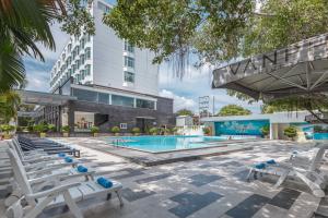 an image of a swimming pool at a hotel at Van Phat Riverside Hotel in Can Tho