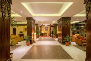 a lobby of a hotel with potted plants at Hotel Tibet International in Kathmandu