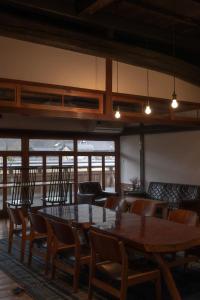 a dining room with a table and chairs at tehen in Kyoto