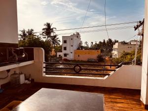 a balcony with a view of a city at AURO BAY inn in Kuilapayam