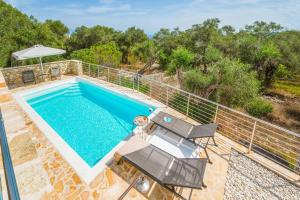 an overhead view of a swimming pool on a house with a balcony at Villa Ares in Bogdanátika