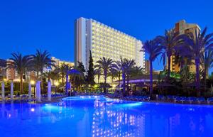 a large swimming pool in front of a hotel at SOL by Meliá Pelícanos Ocas in Benidorm
