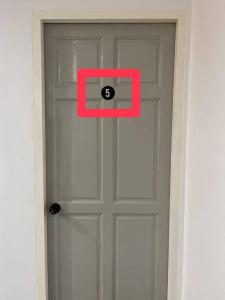 a door with a number in the middle of it at 9 mins to BTS Queen Private Room Share Bath in Amphoe Phra Khanong