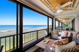 a living room with a view of the ocean at Maui Kai 405 in Honokowai