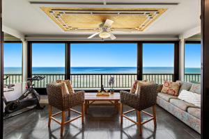 a living room with a view of the ocean at Maui Kai 405 in Honokowai