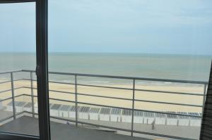 a view of the beach from the balcony of a condo at 4B @ Longchamp in Ostend