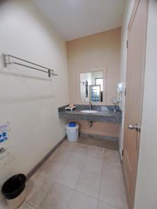 a bathroom with a sink and a mirror at Happy Cottage in Chalong +22 photos