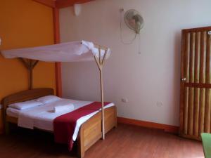 Postel nebo postele na pokoji v ubytování Tambopata Hostel