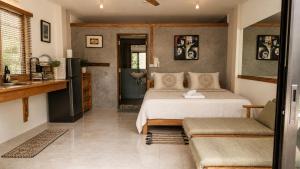a bedroom with a bed and a sink in it at Tea Moon Boutique Stay in Thong Sala