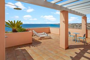 a balcony with a view of the ocean at Holiday World Casamaïa Apartments, Affiliated by Meliá in Benalmádena