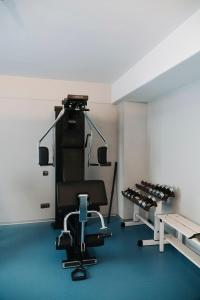 a room with a gym with a chair at Palacio de Avilés, Affiliated by Meliá in Avilés