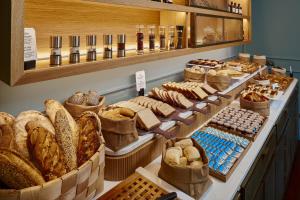 a bakery with many different types of bread on display at Palacio de Avilés, Affiliated by Meliá in Avilés