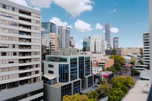 an aerial view of a city with tall buildings at Punthill Spring Hill in Brisbane