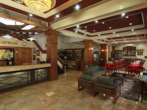 a store with chairs and tables and a restaurant at Hotel Supreme in Baguio