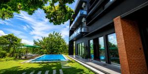 a house with a swimming pool in a yard at Secret Paradise Edge in Weligama