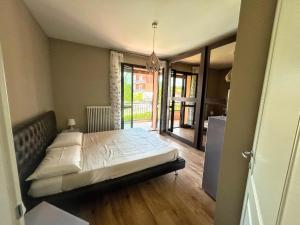 a bedroom with a bed in the middle of a room at Nice villa with pool and garden in Fermignano +36 photos