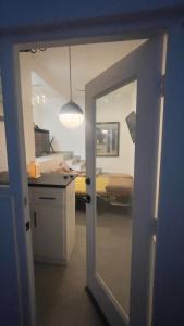 a door leading into a room with a bedroom at Olas de San Marino in Harry Manzo