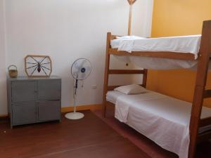 Postel nebo postele na pokoji v ubytování Tambopata Hostel