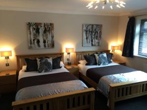 מיטה או מיטות בחדר ב-Barncroft Luxury Bed & Breakfast