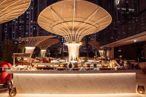 a restaurant in a city at night at ME by Meliá Dubai in Dubai