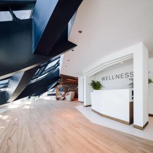 a lobby with a wall with a wellness sign on it at ME by Meliá Dubai in Dubai
