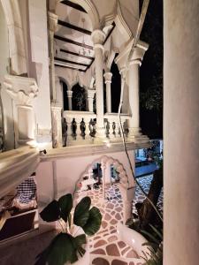 a room with a bathtub and a table with plants at Boutique Villa with a Pool in Kandy