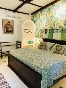 a bedroom with a large bed in a room at Boutique Villa with a Pool in Kandy