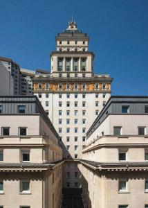a large white building with a tower on top of it at Casa Lucia member of Meliá Collection in Buenos Aires