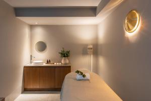 a bedroom with a bed and a sink at Casa Lucia member of Meliá Collection in Buenos Aires +101 photos