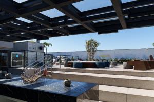 a view of a patio with a table and chairs at Skylux by Tegra in Rio de Janeiro