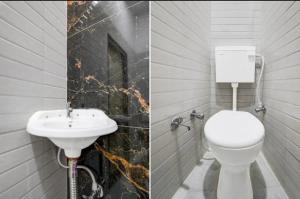 a bathroom with a white toilet and a sink at Hotel Birhana road in Kānpur