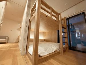 a bedroom with a bunk bed in a room at CONTEL BASE Tokyo in Tokyo