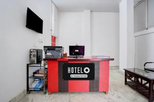 a room with a hotel sign on a table at Hotel O Patel Nagar Patna Formerly Princess Home in Patna